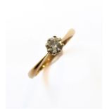 A gold and solitaire diamond ring: hallmarks for London 1912, possibly 18 carat but marks rubbed,