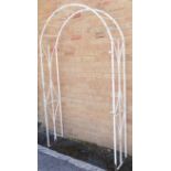 A white-painted iron arbour (113 x 32.5 x 192 cm)