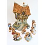 Hand-painted tinkerware: Shambles Inn and seven figures modelled by John Valentine (Teddy, Oscar,