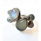 A stylish modern design silver ring set with pear-shaped moonstone and other similar stones (6