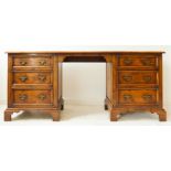 A fine quality pollard-oak sideboard: central kneehole space flanked by two banks of three finely