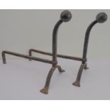 A pair of fireside andirons (45 cm long x 36.5 cm high).