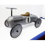 A Gollnest & Kiesel (Germany) child's ride-on metal racing car (approx. 76 cm long and 40 cm high).