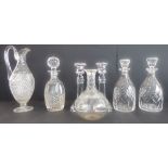 Five quality hand-cut decanters, together with a 19th century style hobnail cut claret jug (