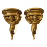 A pair of gilded plaster wall brackets modelled as cherubs (29.5 cm)