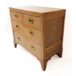 An early 20th century bleached-oak chest: two half-width and two full-width graduated drawers with
