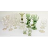 A selection of various drinking glasses to include a set of four finely etched hock glasses