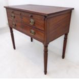 A 19th century mahogany side table: the reeded edged top above a brushing-slide and two full-width