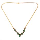 A yellow gold emerald and diamond-set necklace, the front section set with five navette-shaped