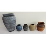 Five stoneware and salt glaze studioware jars: the largest, mottled blue glaze (32cm high)