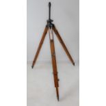 An unusual extendable oak and metal tripod. Possibly of military origin, and now adapted as a