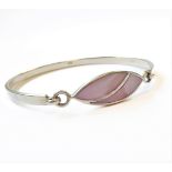 A lady's silver bangle with hooked elliptical front with a polished lustre hardstone (boxed)