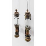 A pair of early 20th century GWR wall-mounting brass carriage lamps with glass shades and pierced