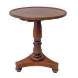 A William IV or early Victorian period circular tilt-top mahogany occasional table: turned stem with