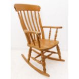 A 19th century style (modern) lathe-back beech rocking-chair