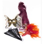 Three ornate Venetian-style masquerade masks (two with feathers) and a fan (a/f)