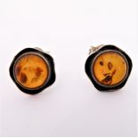 A pair of flowerhead silver earrings set with circular amber with spangles (boxed)