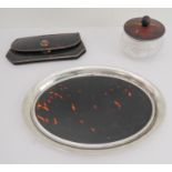 Three pieces comprising: an early 20th century oval silver-mounted and tortoiseshell tray (27 x 19.5