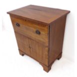 An early 19th century mahogany commode (now converted): hinged top and drawer-front lifting up