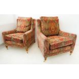 Two fine and modern upholstered armchairs: multi patterns against a red ground and each on square