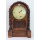 A 19th century walnut cased mantle clock: cream dial with Roman numerals, the movement striking on a