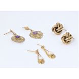 Three pairs of earrings: a hallmarked gold pair as knots; one further gold pair as droplets with