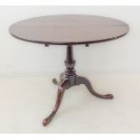 An 18th century circular oak tilt-top 'birdcage' mechanism occasional table (with restorations). The