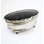 A silver and tortoiseshell jewel box by Mappin and Webb. Original lining and standing on shaped