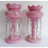 A pair of 19th century pink glass table lustres (30 cm high) Condition Report: The items are dusty