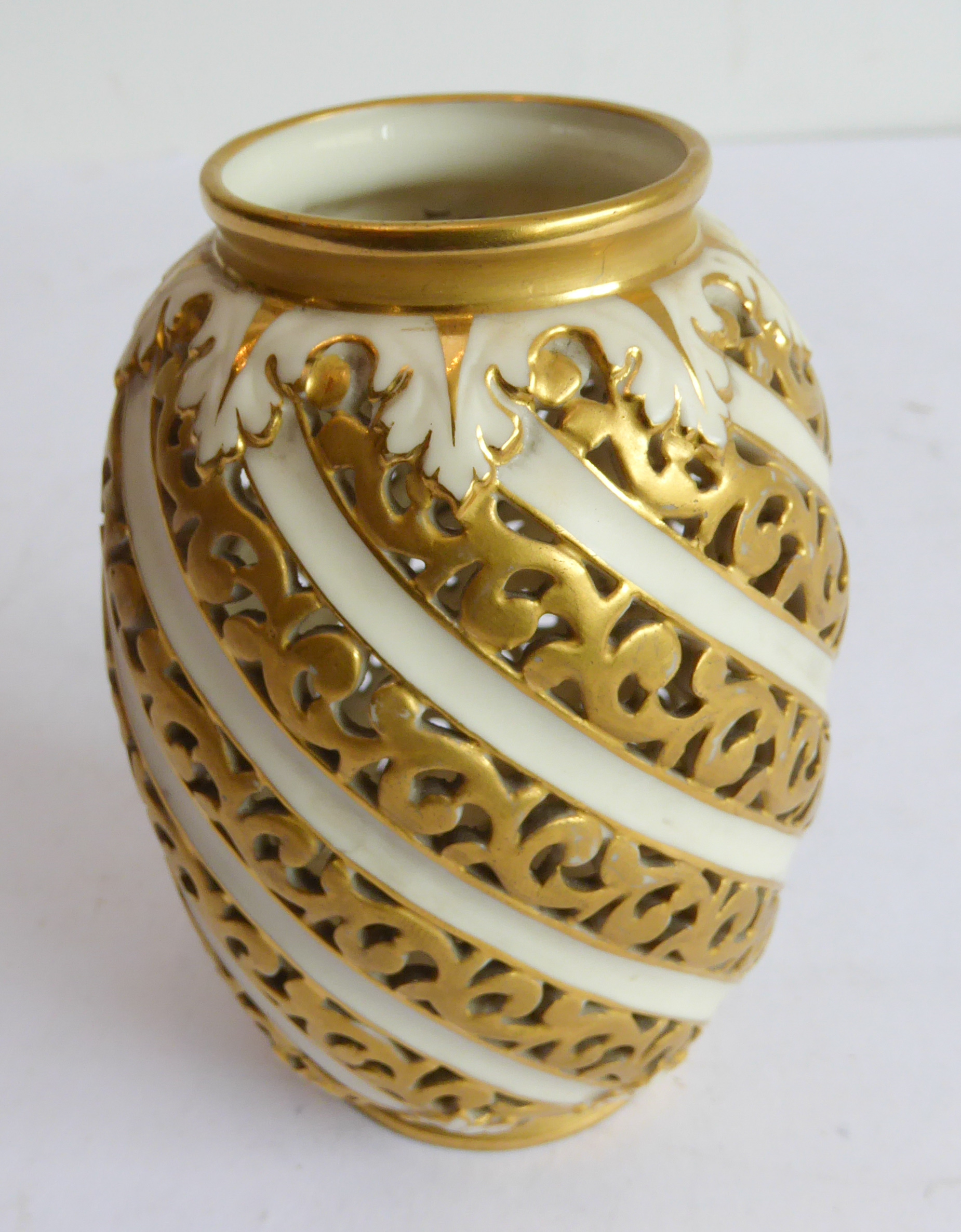 A late 19th century Royal Worcester China Works gilt-highlighted and reticulated porcelain vase,