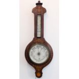 A late 19th century wheel aneroid barometer: inlaid with boxwood with scrolling foliage and flames