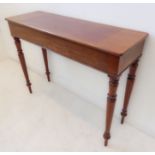 An unusual mid-19th century mahogany centre table of slim proportions; the slightly overhanging