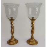 Two modern brass storm lamps with inverted bell-shaped shades (each 49 cm high)