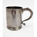 A small hallmarked silver tankard of cylindrical form: S-shaped handle and raised on spreading