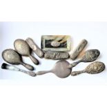 Seven silver-backed dressing-table brushes and three other pieces: a set of four (two hair brushes