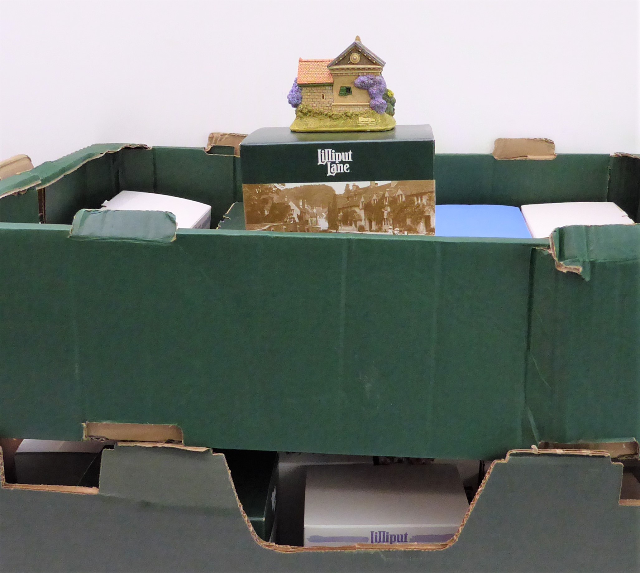 Twenty-eight boxed Lilliput Lane models: L2057 - Hampton Moat L3378 - Get Your Buns L3771 - It’s All