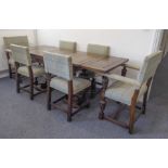 A very fine quality mid-20th century extending oak dining table in Elizabethan style and with six