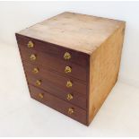 A mahogany-faced bank of five full-width drawers with cast gilt-metal handles, pine top and