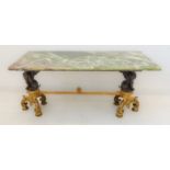 A green onyx coffee table with cast base (probably ormolu and bronze): two supports as winged