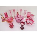 Fourteen pieces of mostly 19th century cranberry glass to include three frilled-edge vases and