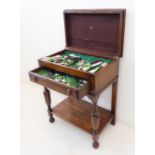 An oak cutlery cabinet containing 129 pieces of Mappin & Webb silver-plated flatware: dinner