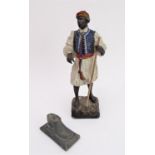 A painted metal blackamoor figure, together with an interesting early 20th century George Morris &