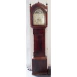 An early 19th century mahogany-cased eight-day longcase clock: the 12-inch arched dial surmounted