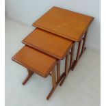 A nest of three mid-20th century Scandinavian style hardwood occasional tables (the largest 52cm