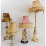 Four lamps comprising three stylish modern lamps with elaborate shades and a 19th century two-