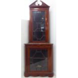 An Edwardian freestanding mahogany, boxwood-strung and marquetry corner cupboard: the 15-panel