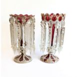 Two large and similar 19th century cranberry table lustres: cameo cut; long glass droplets; circular