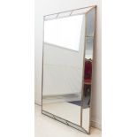 A large modern wall-hanging looking glass from OKA: angular segmented frame and artificial