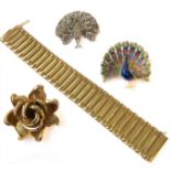 Two peacock brooches with displaying tails: one closed-back set with colourless paste (diameter 4.