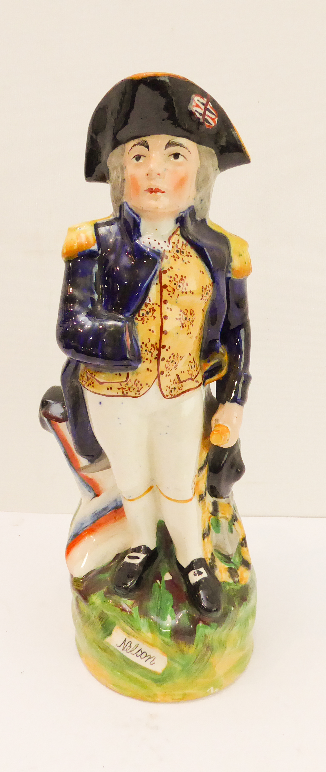 A late 19th to early 20th century Staffordshire pottery jug modelled as Nelson (29 cm high)